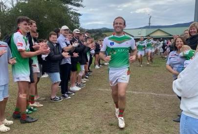 Jamberoo Superoos player-coach Jono Dallas (centre) running onto the field at Kevin Walsh Oval for his final regular season match at home before retiring at season's end. Picture supplied.