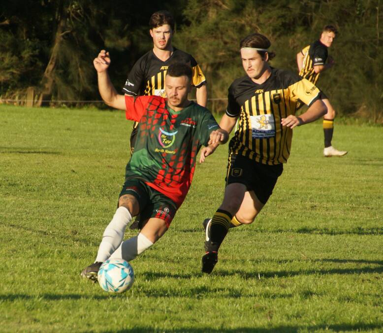 FOCUS: Illaroo's Alex James-Corsano with the ball while Bomaderry's Sam Baxter provides pressure. Picture: RACH HALL