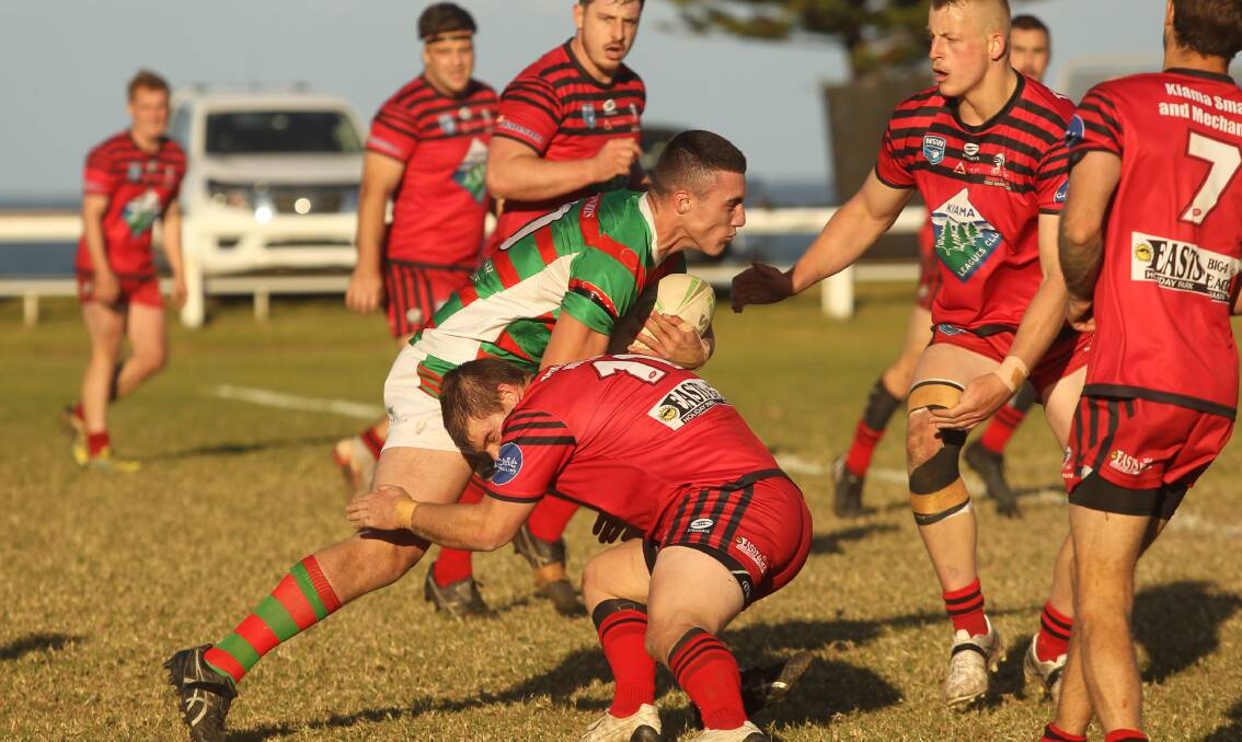 Kiama battling in a derby clash with Jamberoo last season. Picture by David Hall 
