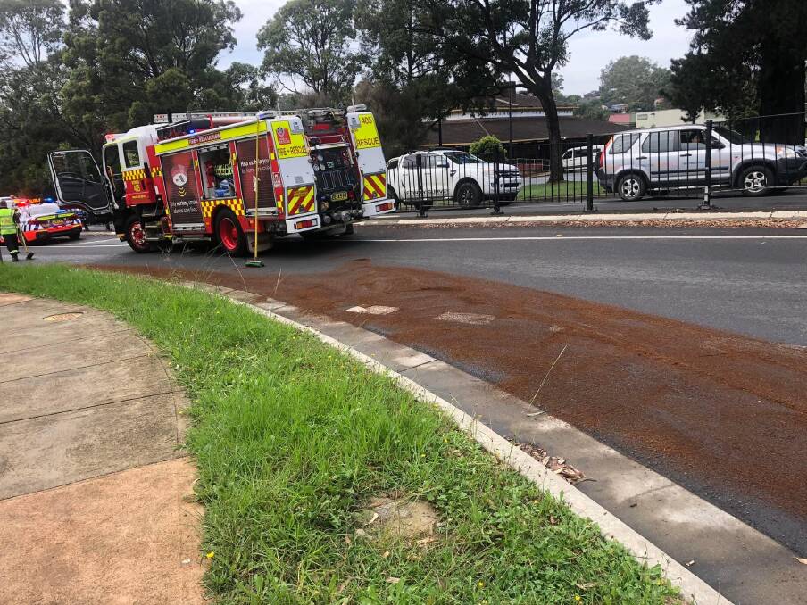 Nowra firefighters have cleaned up spilled fuel from a crash on Kalandar St. Picture by Fire and Rescue NSW.