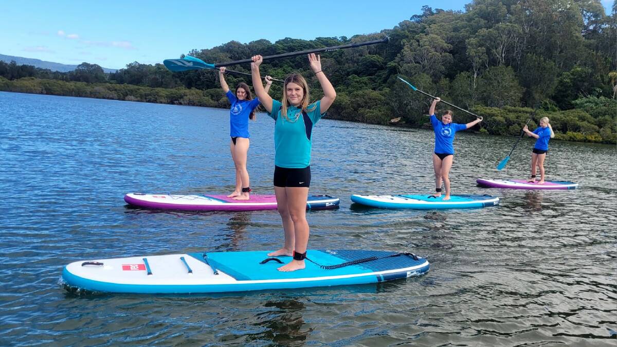 Shoalhaven High School students enjoy stand-up paddleboarding ahead on the inaugural White Ribbon Cup on July 1. Picture supplied.