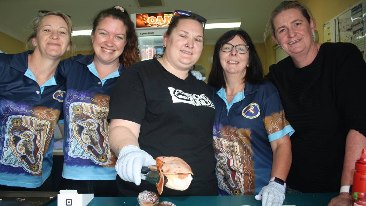 Serving up egg and bacon rolls to hungry voters and their families at the North Nowra Public School are Sam Rowell, Anita Fischer, Kylie Hall, Esther Haughton and Heather Collin. Picture by Glenn Ellard.