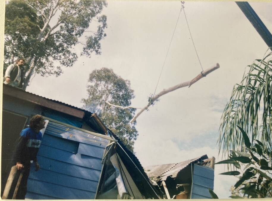 A crane had to be called in to remove tree branches from Gary and Shelli Cotton's damaged roof in 1998. Picture supplied.