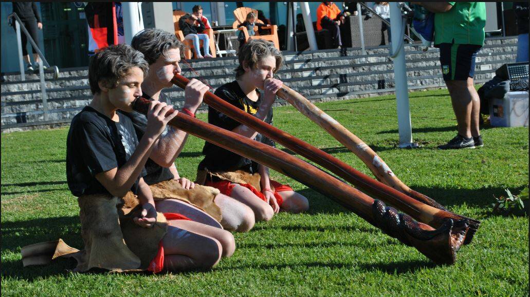 Ulladulla High School didgeridoo group members Joseph Stewart, Jayden Perry and Riley Nolan perform during the 2018 Ngulla NAIDOC Festival. File photo.