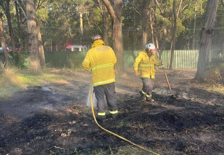 RFS volunteers work to contain an escaped pile burn beside The Wool Road at Worrowing Heights. Picture supplied.