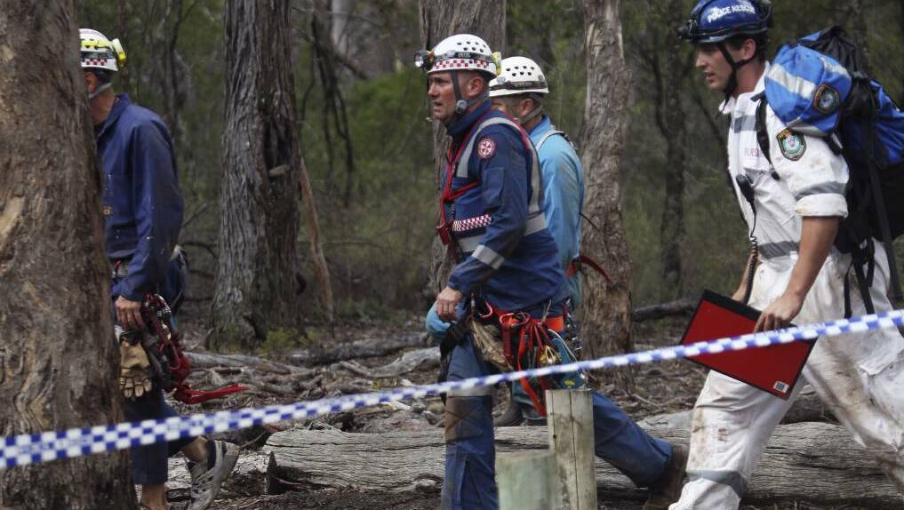 NSW Ambulance Specialty Casualty Access Team paramedic Jason Watson (centre) back in fresh air after his 11-hour rescue in the Bungonia cave system in 2014. Picture by Nick Moir.