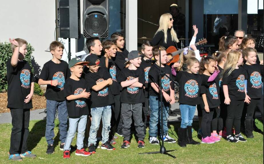 Ulladulla Primary School students perform their NAIDOC rap during the 2018 Ngulla Festival, to a guitar riff composed by Richard Barry. File photo.