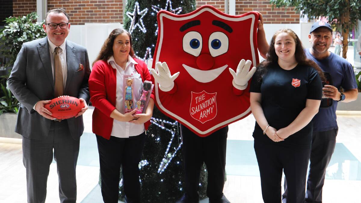 James Cudmore from NGM joins Salvation Army's Illawarra and South Coast fundraising manager, Karen Walker and volunteers to launch the local Salvos Christmas appeal. Picture supplied.
