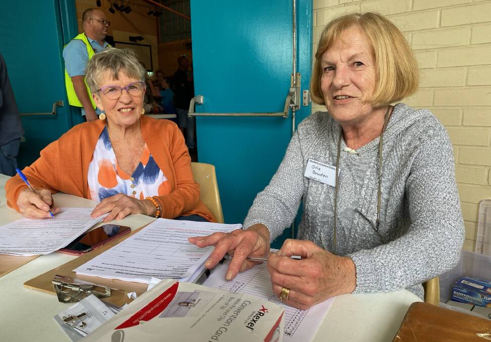 Lorraine Hughes of Cambewarra and Julie Bowden of South Nowra keep a close eye on the figures and sales during the Shoalhaven Avicultural Society bird sale. Picture by Glenn Ellard.