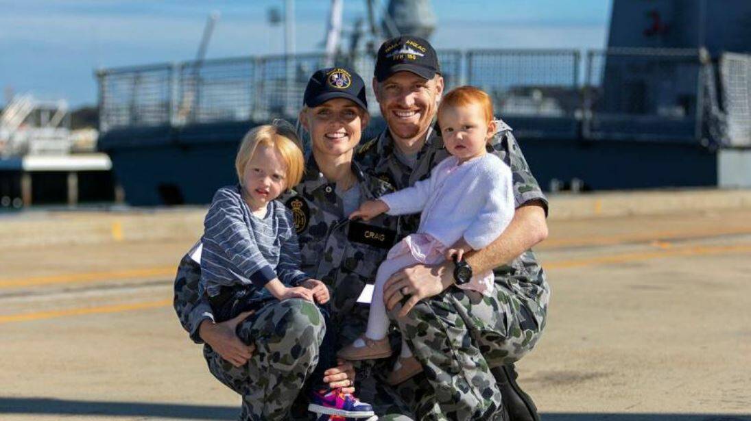 Lieutenant Commander Timothy Craig pictured after returning from deployment on HMAS Anzac in 2021, with wife Lieutenant Brittany Craig and children Hunter, left, and Harper. Picture by Leading Seaman Ronnie Baltoft.