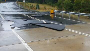Damage to Naval College Road after flooding in Duck Creek. Picture by Rarge Schaffer.