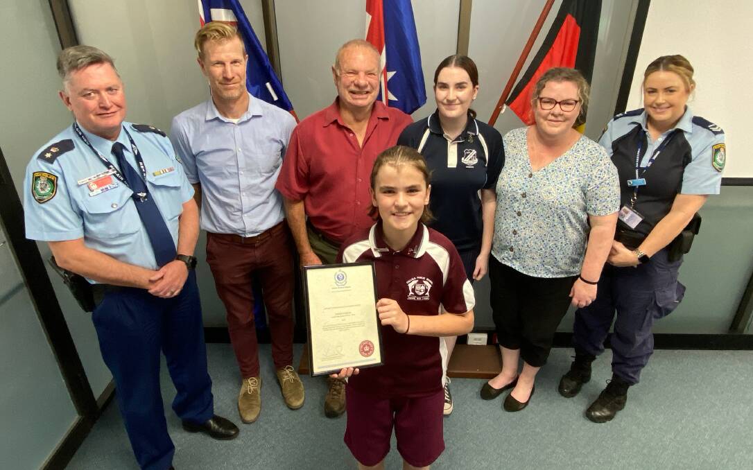 Owen Child is joined by Chief Inspector Ray Stynes from South Coast Police, Callala Public School assistant principal Andrew Schubert, Owen's Pop Mark Woods, sister Amity Child, mum Cadi Woods and South Coast Police youth officer Kyriana van den Belt. Picture by Glenn Ellard.