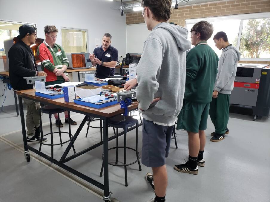 Pennant training instructors lead Bomaderry High School students in the Illawarra Shoalhaven Regional Defence Network Aircraft Maintenance Engineering Attraction Program during National Careers Week at Industry Hub 4.0 on the UOW Shoalhaven campus. Picture supplied
