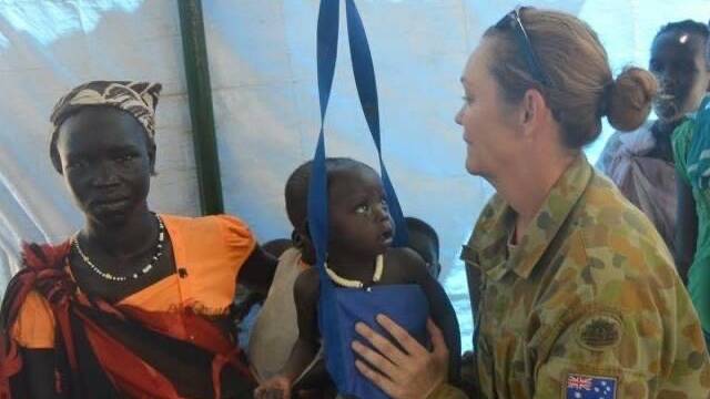Selena Clancy during her Army service assisting with malnourished babies in South Sudan. Pictures supplied