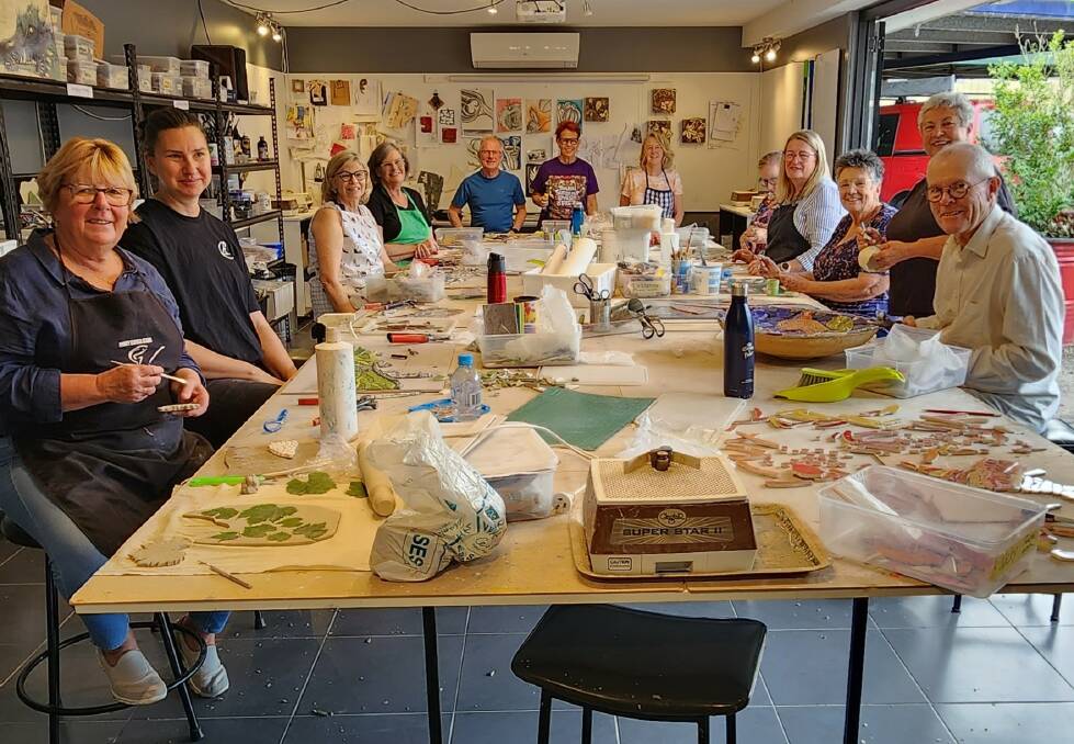 Students attend a Thursday morning mosaic class with artist Dra Rgnvaldsdttir at Mad Cow Studio. Picture supplied.