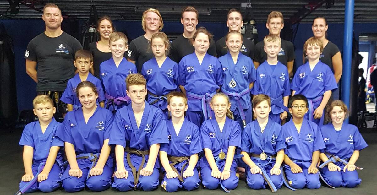 REWARD FOR THEIR EFFORT: Bomaderry's Southern Fitness and Martial Arts Centres' junior kick defence green, purple and blue belts.