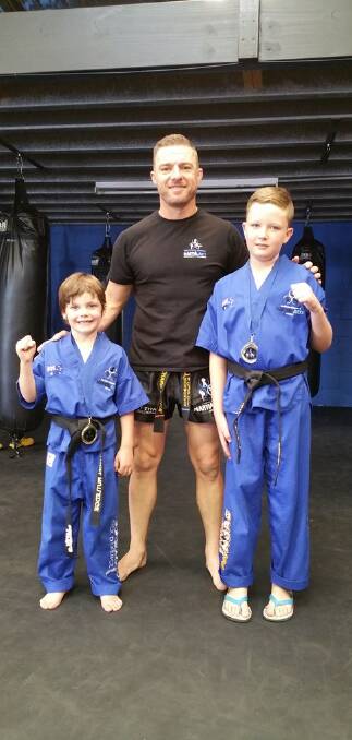 DYNAMIC DUO: Southern Fitness and Martial Arts Centres Bomaderry's coach Richard Neradil with New Little Ninja Black Belts Ashton Rutledge, Rhys Pierson.