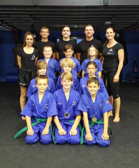 FUTURE STARS OF THE SPORT: Southern Fitness and Martial Arts Centres Bomaderry's Green Belt Junior Kick Defence with their coaches.