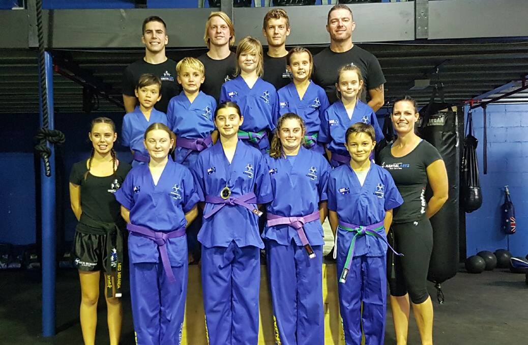COMMITMENT TO IMPROVING: Bomaderry's Southern Fitness and Martial Arts Centres' junior kick defence - purple and blue belts.