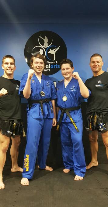 BEST IN THE BUSINESS: Bomaderry's Southern Fitness and Martial Arts Centres' junior kick defence black belts, with their instructors.