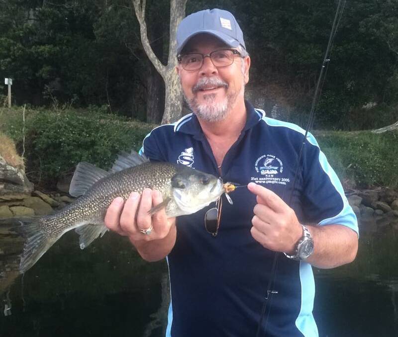 Bass player: One of Australia's best custom fishing rod builders, Mark Fisher from Outback Rods, with a solid Shoalhaven River Australian Bass.