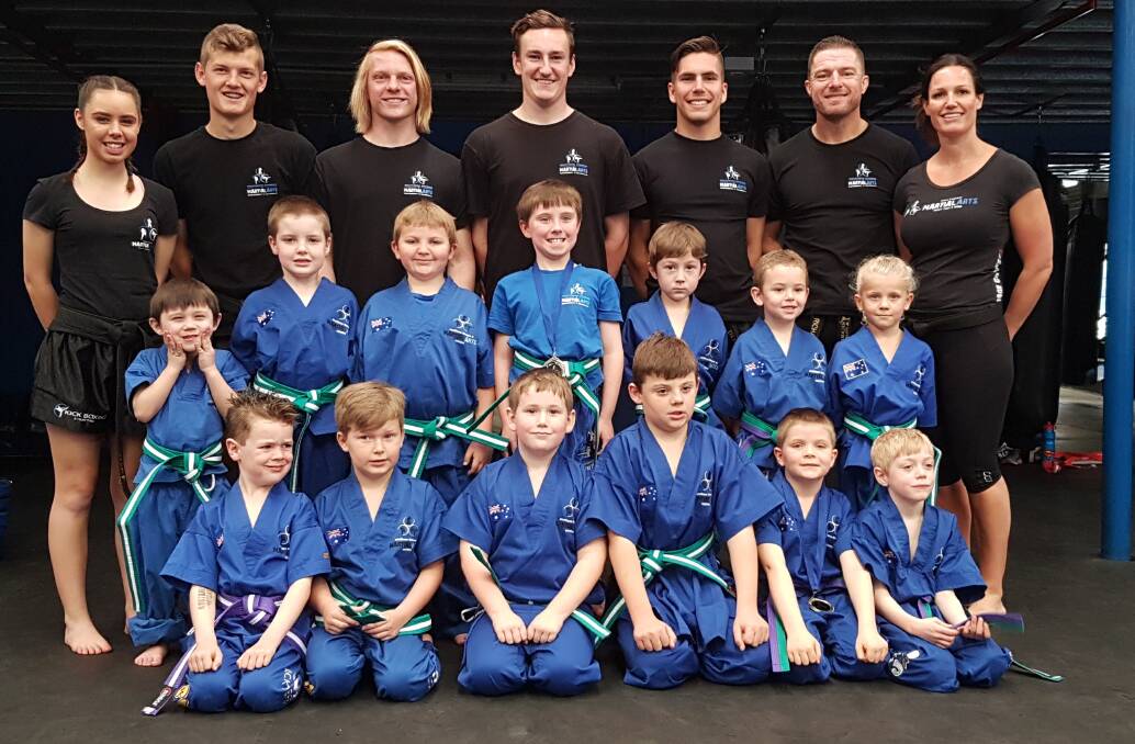 STRENGTH: Southern Fitness, Martial Arts and CrossFit Centre Bomaderry's purple and green belt little ninjas with their instructors.