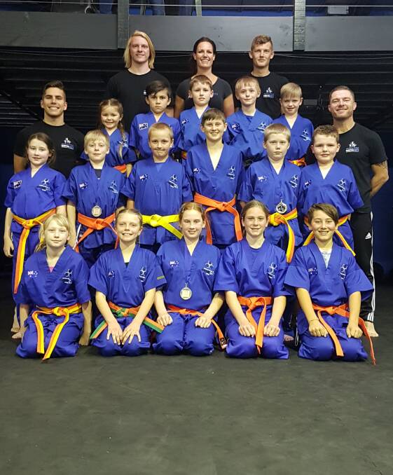 HARD WORK PAYS OFF: Southern Fitness, Martial Arts and CrossFit Centre Bomaderry's yellow and orange belts - junior kick defence class.