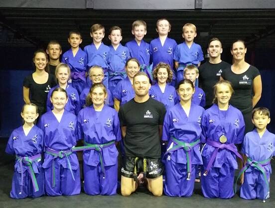 HARD WORK PAYS OFF: Southern Fitness and Martial Arts Centres Bomaderry's Blue and Purple Belt Junior Kick Defence at the gradings.