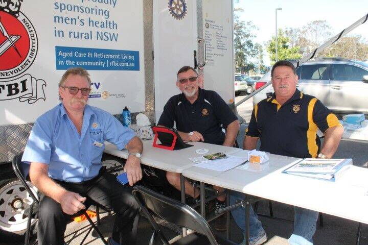 SUPPORT: Rob Wooley (left) was the male nurse last time the Mherv visited Nowra and is pictured with former Rotarians Greg McLeod (centre) and Rob Russell.