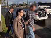 Detectives lead Regan Pidding from a Warilla home following his arrest. Picture supplied by NSW Police Force