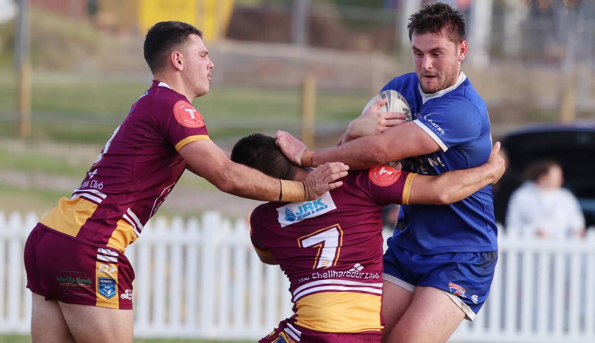 Gerringong's Jake Taylor takes on the Shellharbour defence. Picture by Sylvia Liber