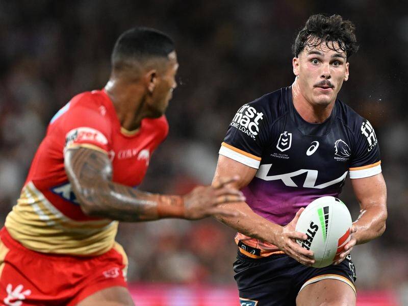 Broncos' Herbie Farnworth carries against Wayne Bennett's Dolphins team, which he joins next year. (Dave Hunt/AAP PHOTOS)
