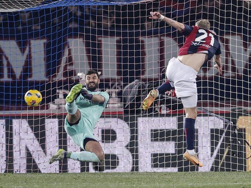 Jens Odgaard scores his late goal to clinch Bologna's 2-0 triumph over Fiorentina. (EPA PHOTO)