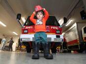 Eddie Bailey, 2, at Wollongong Fire and Rescue station. Picture by Robert Peet
